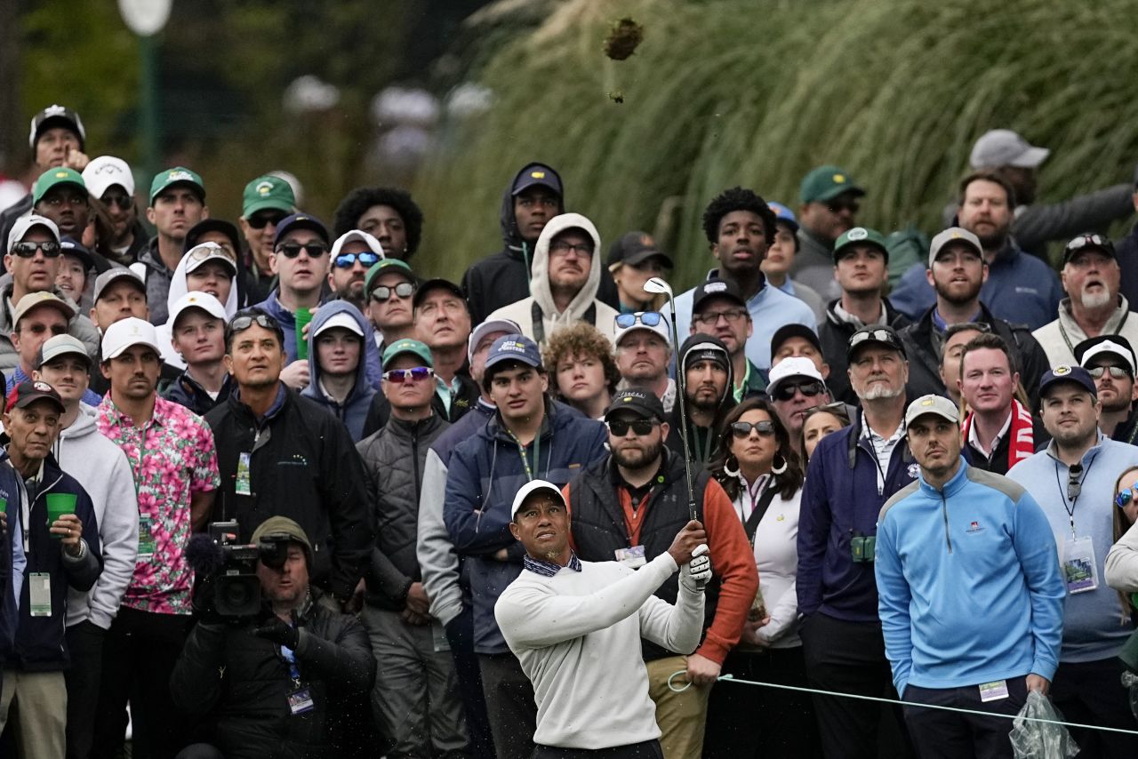 A crowd watches Woods hit a shot on the third hole Saturday.