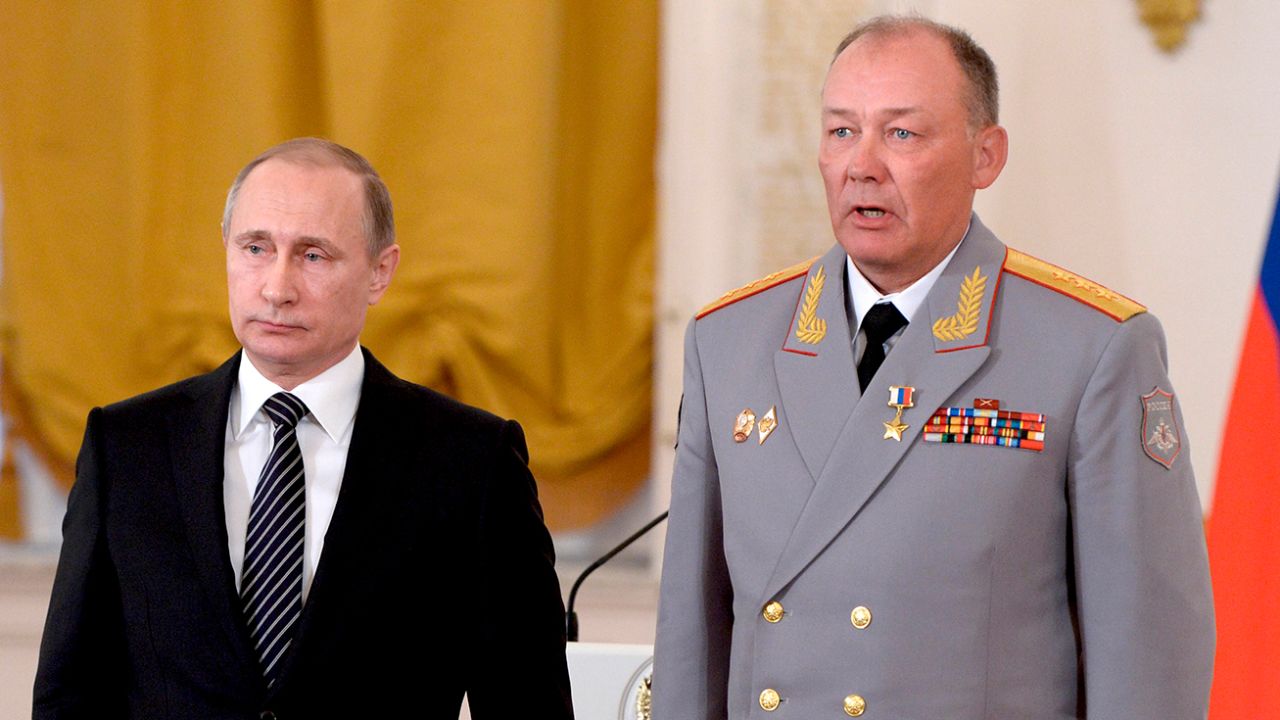 In this pool photo taken on Thursday, March  17, 2016, Russian President Vladimir Putin, left, poses with Col. Gen. Alexander Dvornikov during an awarding ceremony in Moscow's Kremlin, Russia.