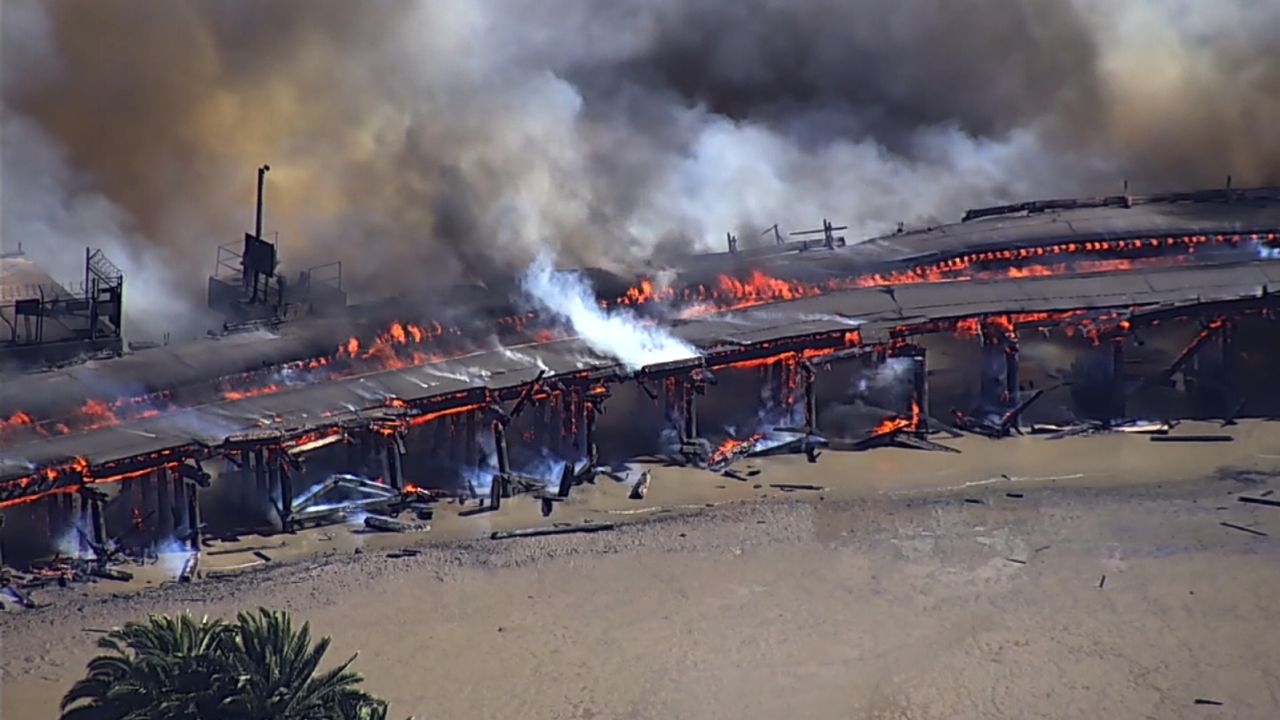 Firefighters respond to a four-alarm blaze near the docks in Benicia, California.