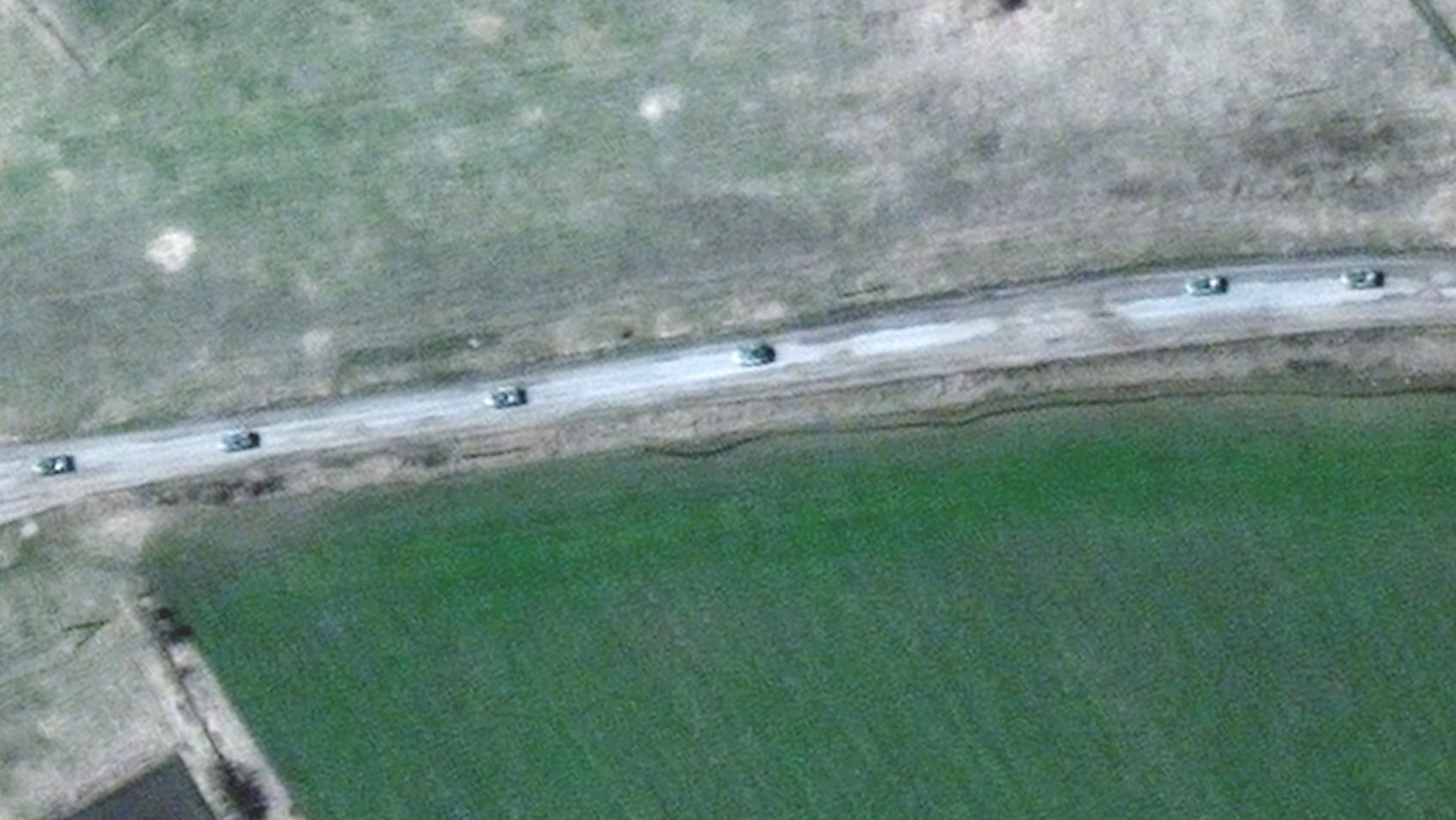 A satellite image from Maxar Technologies shows what appears to be an 8-mile-long Russian convoy to the east of Kharkiv.