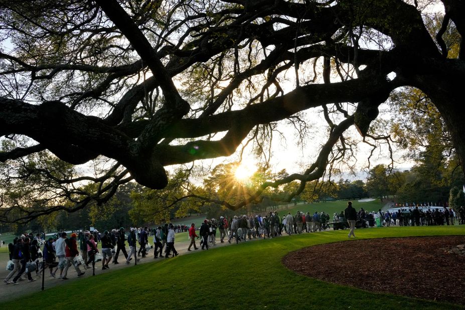 Fans — or patrons, as they're referred to at Augusta National Golf Club — leave the course on Saturday.