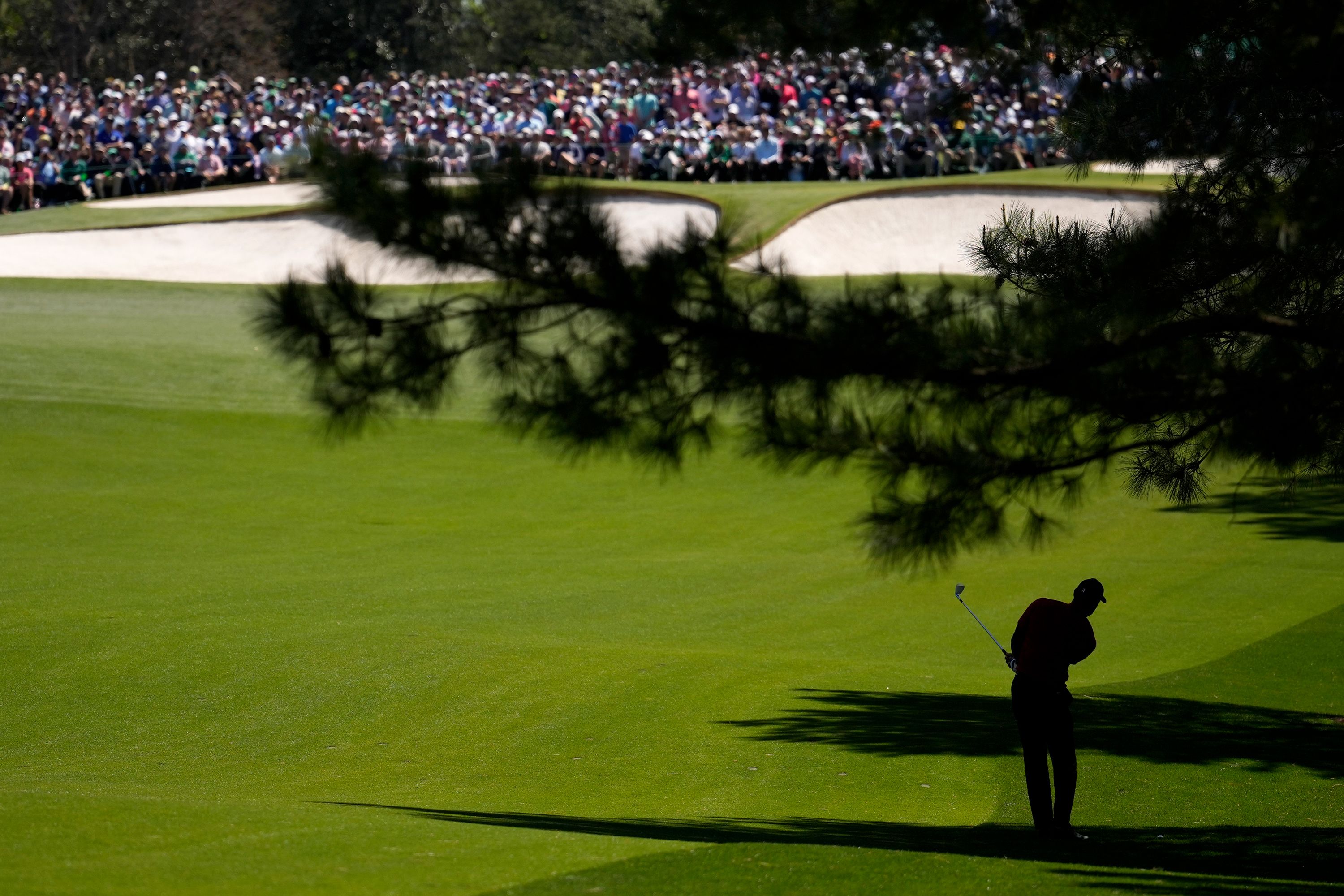 Woods hits from the seventh fairway on Sunday.