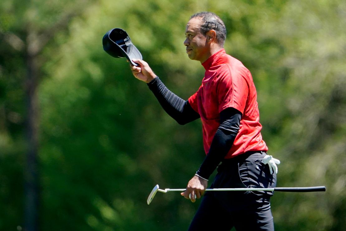 Woods tips his hat at the No. 12 tee during the final round of the Masters.
