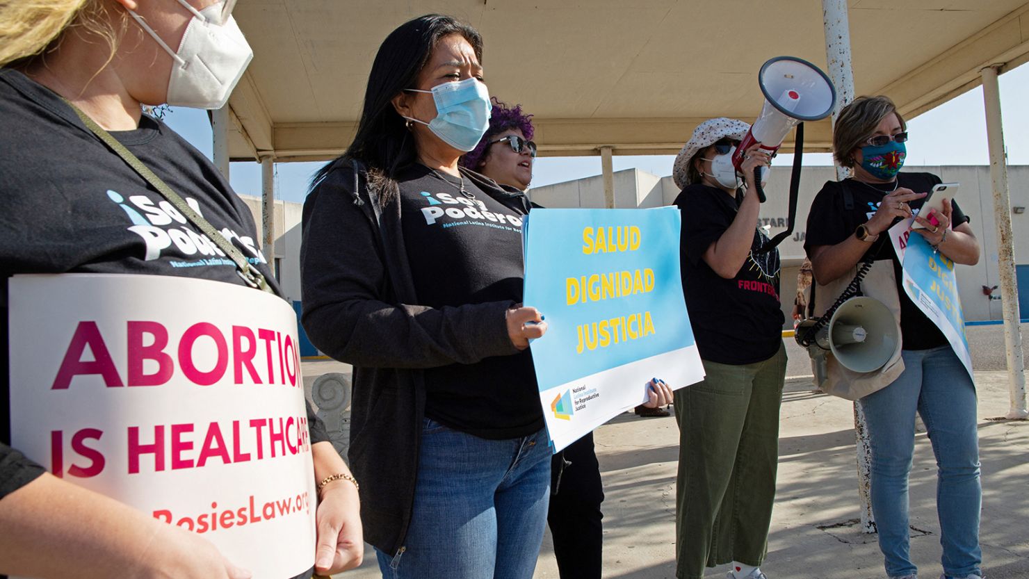 Protesters stand outside the Starr County Jail after a woman was charged with murder for allegedly performing what authorities called a "self-induced abortion" in Rio Grande City, Texas, on April 9.