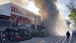 A view shows smoke rises out of a Home Depot building after a massive fire in San Jose, California, on April 9.