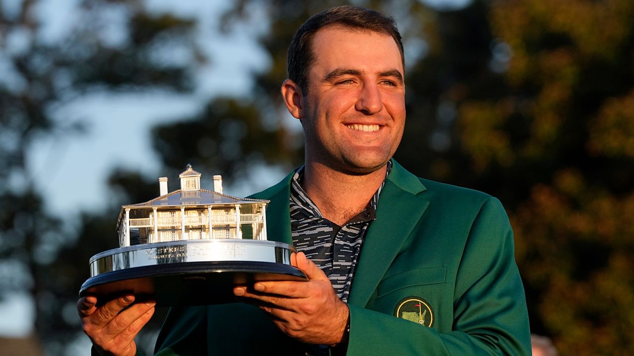 Scheffler holds the championship trophy after winning the 86th Masters.