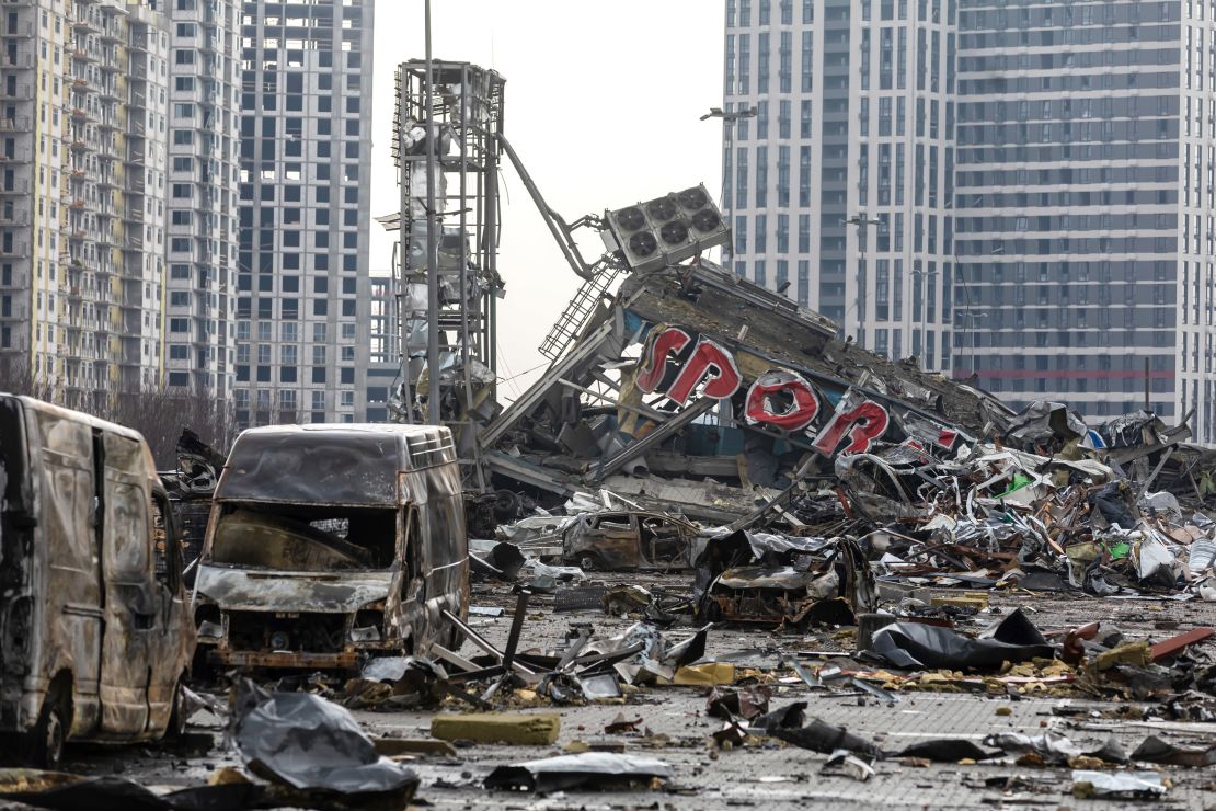 Burnt cars and the ruins of a shopping center are seen following a Russian shelling attack in Ukraine.