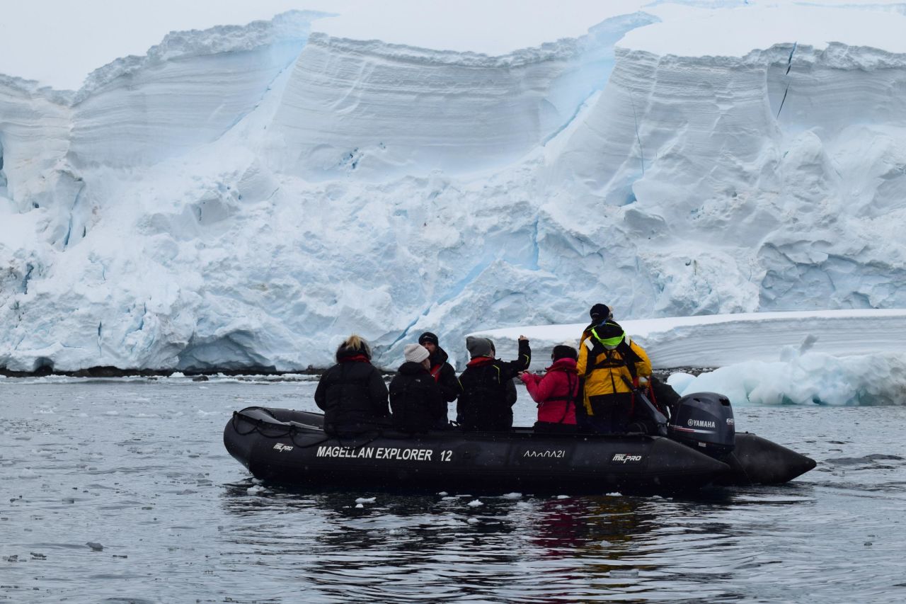 Zodiac boats take ship passengers on excursions to explore the frozen landscape.