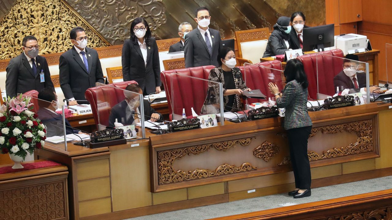Indonesia's Minister of Women Empowerment and Child Protection I Gusti Ayu Bintang Darmawati chats to Speaker of the House of Representatives Puan Maharani after parliament passed the sexual violence bill in Jakarta on April 12.