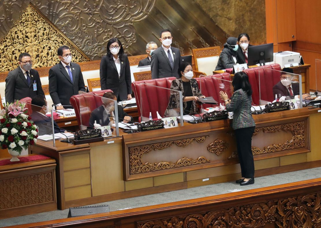 Indonesia's Minister of Women Empowerment and Child Protection I Gusti Ayu Bintang Darmawati chats to Speaker of the House of Representatives Puan Maharani after parliament passed the sexual violence bill in Jakarta on April 12.