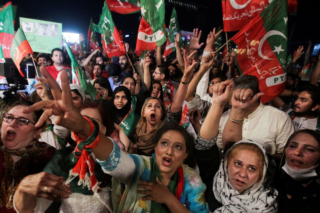 Supporters of the Pakistan Tehreek-e-Insaf (PTI) political party wave flags and chant in support of former Pakistani Prime Minister Imran Khan in Lahore, Pakistan April 10, 2022.