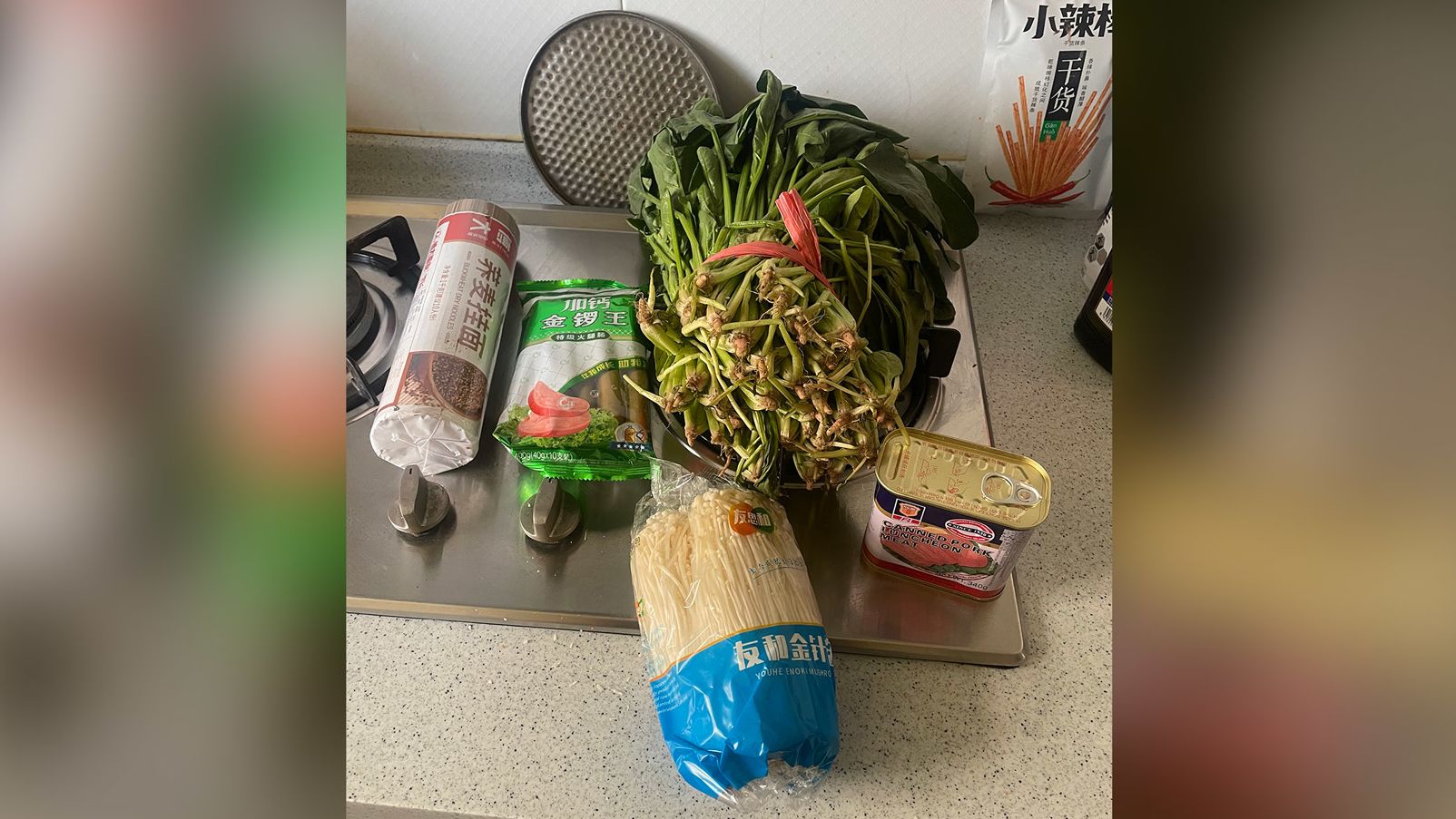 A government food package sent to Shanghai residents Rodrigo Zeidan and Melissa Nogueira, including noodles, sausages, spinach, mushrooms, SPAM. 