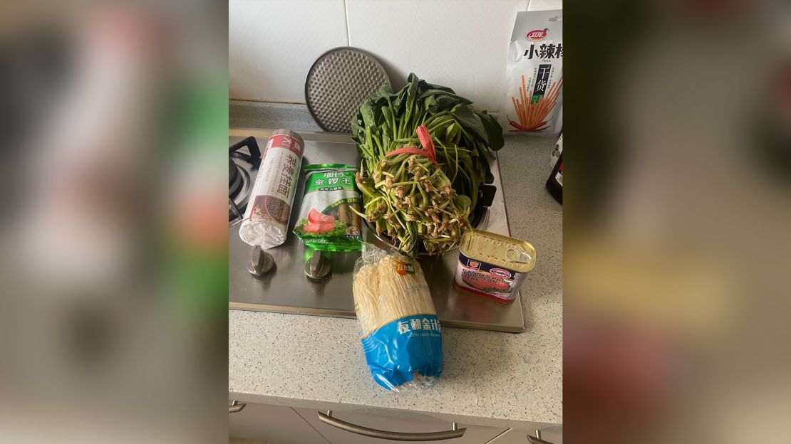 A government food package sent to Shanghai residents Rodrigo Zeidan and Melissa Nogueira, including noodles, sausages, spinach, mushrooms, SPAM. 
