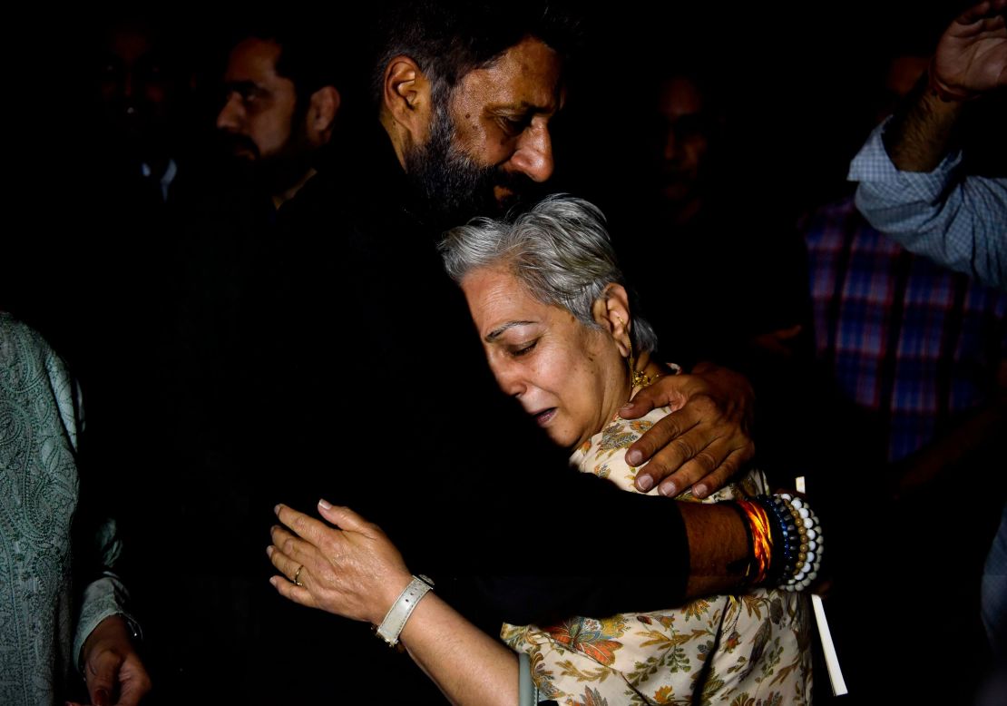 A Kashmiri Pandit woman hugs director Vivek Agnihotri after a special screening for Kashmiri Hindus, on March 13, 2022 in Gurugram, India. 