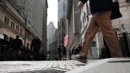 People walk by the New York Stock Exchange (NYSE) on April 04, 2022 in New York City. 