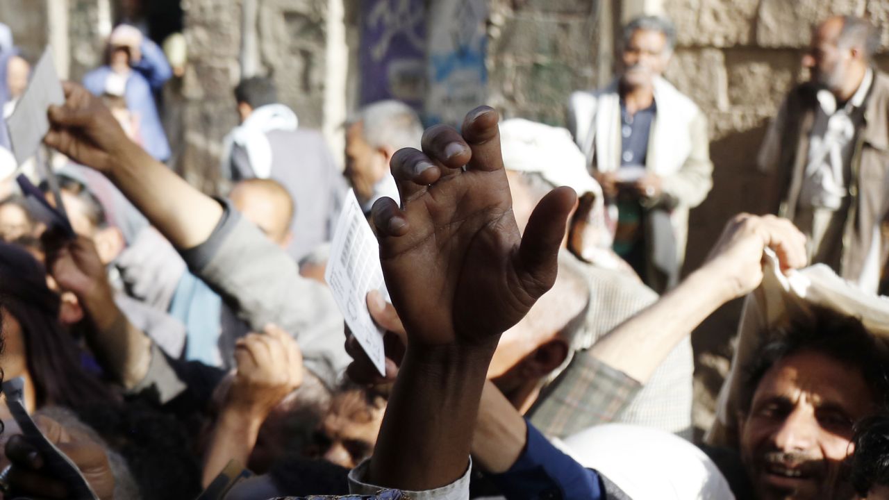 People affected by war wait to receive free meals provided by a charitable kitchen in the Mseek area on April 02, 2022 in Sana'a, Yemen.