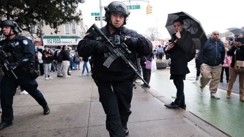 Police and emergency responders gather outside the 36th Street subway station in Brooklyn, New York, on Tuesday, April 12.