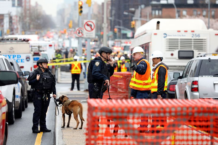 Officers with bomb-sniffing dogs patrol the area.