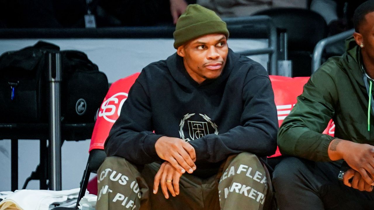 Westbrook watches from the sidelines.