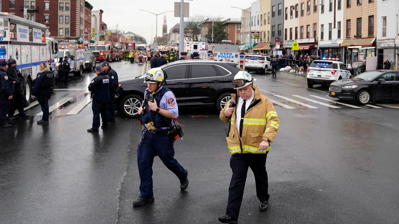 Emergency personnel gather Tuesday at a subway stop in the Brooklyn borough of New York. 