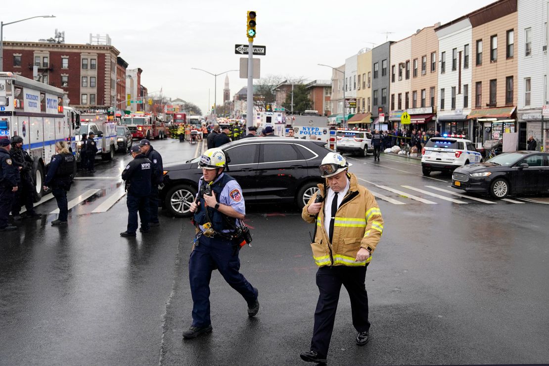Emergency personnel gather Tuesday at a subway stop in the Brooklyn borough of New York. 