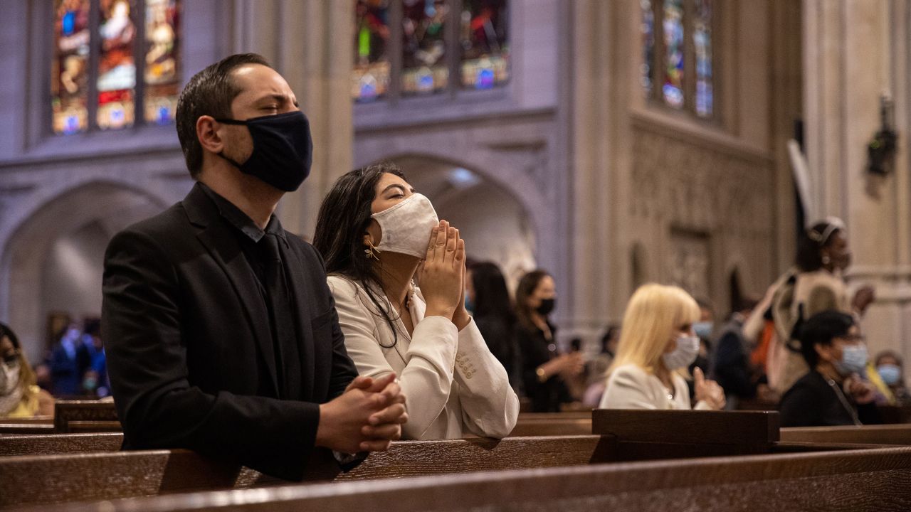 People pray during an Easter mass at Saint Patrick's Cathedral in New York City on April 4, 2021. Some pastors say they sense more joy among their congregation this year.