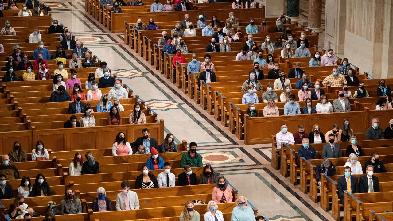 People attend Easter Sunday Mass while adhering to social distancing guidelines at the Basilica of the National Shrine of the Immaculate Conception in Washington on April 4, 2021. 