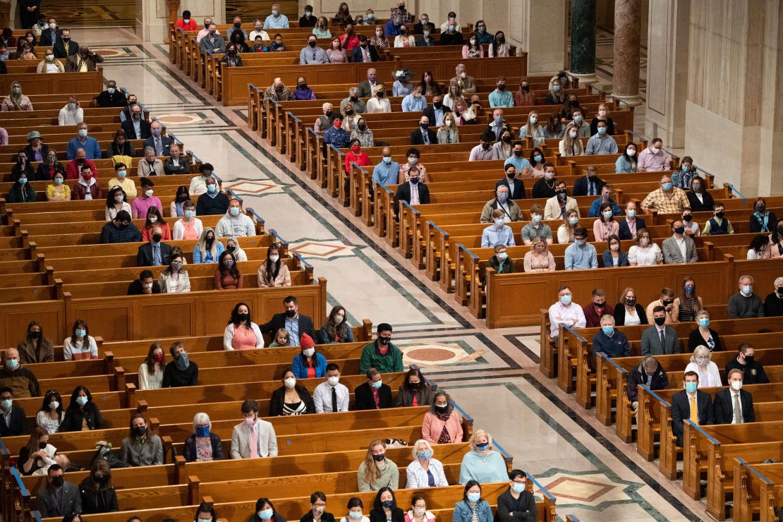 People attend Easter Sunday Mass while adhering to social distancing guidelines at the Basilica of the National Shrine of the Immaculate Conception in Washington on April 4, 2021. 