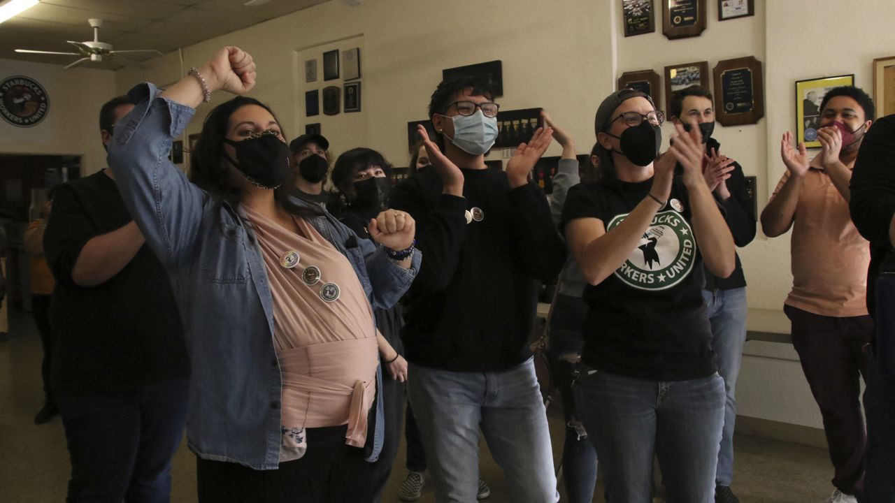 Starbucks Workers United partners celebrate a victory after watching the union vote count in Mesa, Arizona.