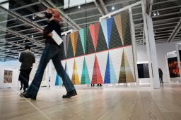 People walk through the Whitney Biennial show at the Whitney Museum of Art on April 06, 2022 in New York City. 