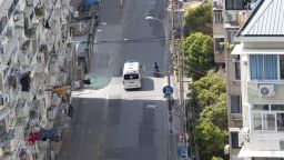 An ambulance runs in an empty street in Shanghai, China Friday, April 08, 2022.