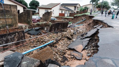 A severely damaged road and home following heavy rains in Durban on Tuesday. 