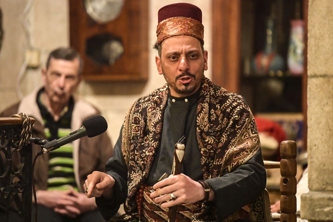 A traditional "hakawati" story-teller performs late after midnight during the Muslim holy fasting month of Ramadan, at the historic Dar Halabia hotel (restored after damage during the Syrian conflict) in the Bab Antakya (Antioch Gate) area of the old city of Syria's northern Aleppo, on April 12.