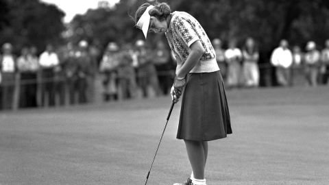 Spork sinks a short putt during the Women's Western Open Golf tournament at Des Moines, Iowa, in June 1946.