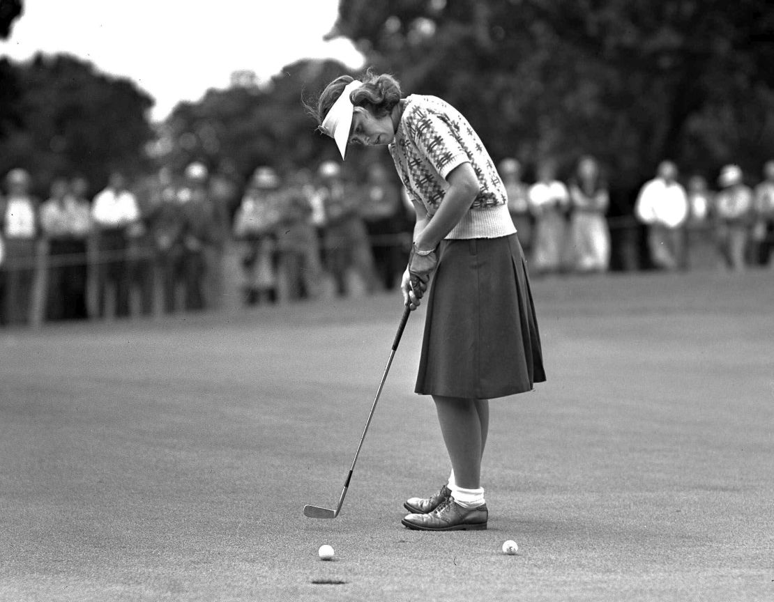 Spork sinks a short putt during the Women's Western Open Golf tournament at Des Moines, Iowa, in June 1946.