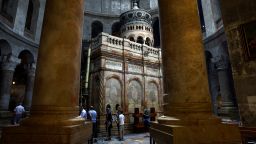 People visit the Church of the Holy Sepulchre in Jerusalem's Old City, April 11, 2022. 