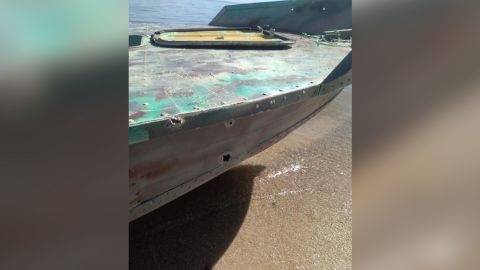 Bullet or shrapnel holes are pictured on the boat that was attacked.