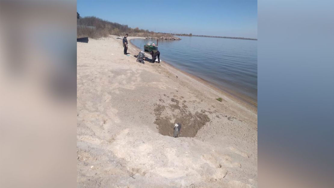 The remnants of what appears to have been a rocket, seen on the banks of the the Dnipro river.
