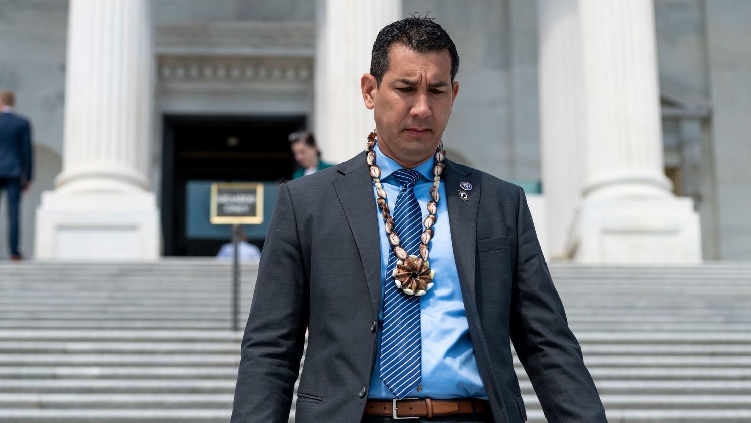Rep. Kai Kahele, a Democrat from Hawaii, walks down the House steps in May 2021.