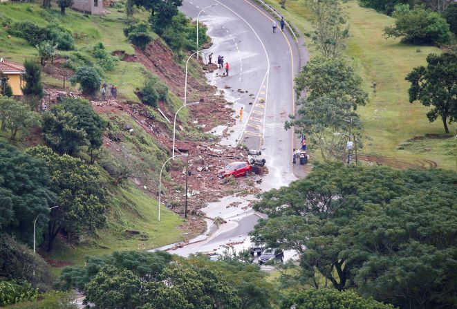 People begin cleaning up damage in Durban on April 12.