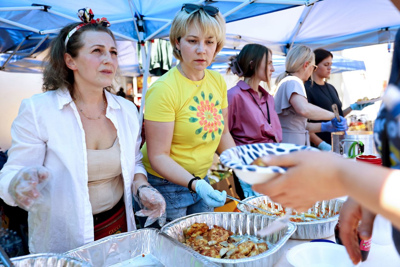 Volunteers have come to help at the government-run shelter in Tijuana. This group, photographed on April 7, includes Ukrainians who live in Los Angeles and are serving Ukrainian food to asylum-seekers.