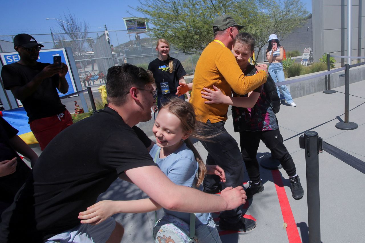 Volunteers in San Ysidro, California, welcome Ukrainians who've crossed into the United States on April 7.