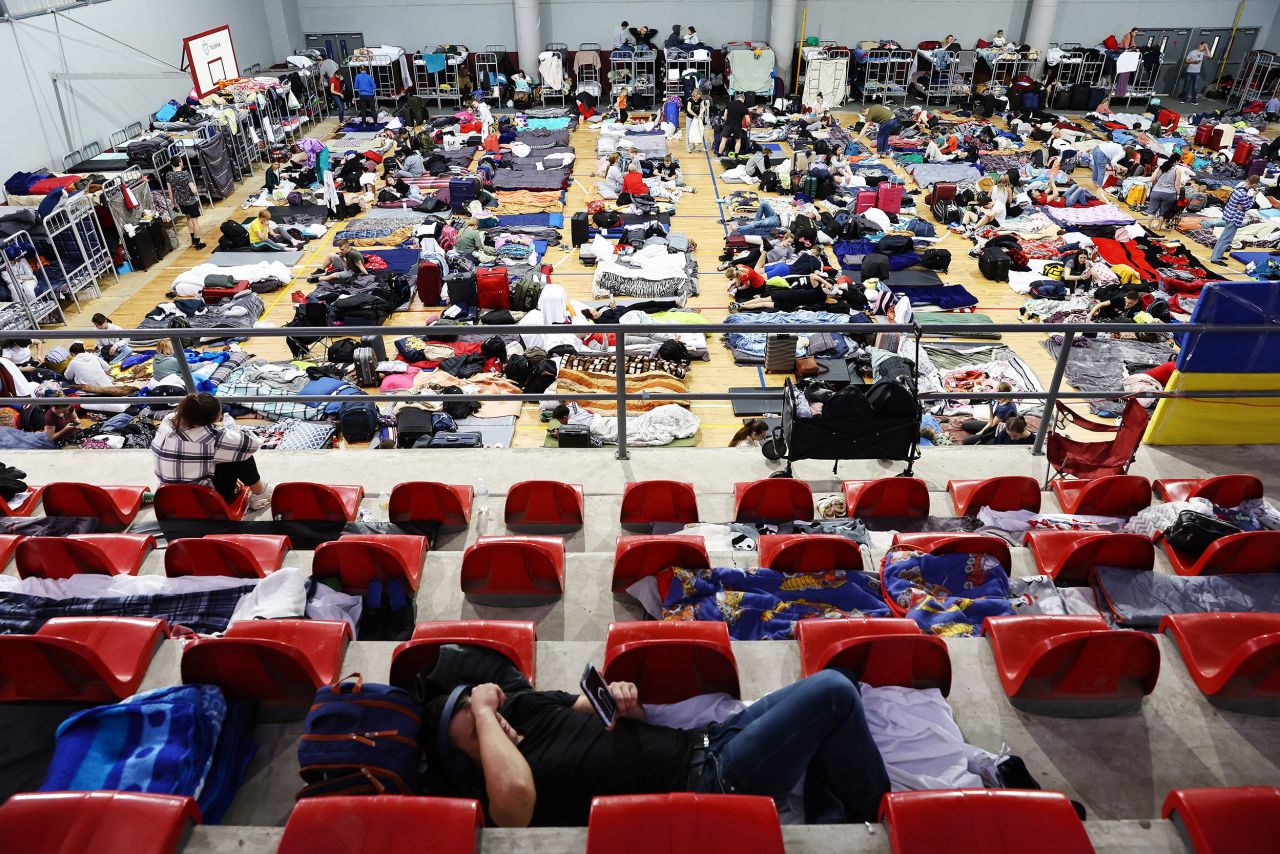Ukrainians who hope to seek asylum in the United States gather on April 6 in a government-run shelter at the Benito Juarez Sports Complex in Tijuana. The facility also housed Central American migrants who came to the city in a caravan in 2018.
