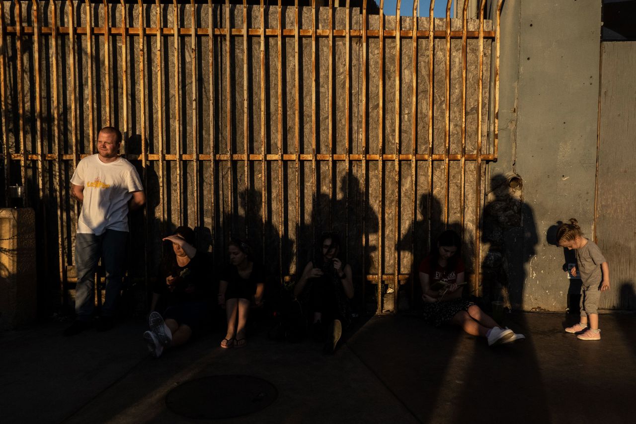 Ukrainians wait to cross the San Ysidro Port of Entry bridge in Tijuana on March 23. Ukrainians hoping to seek refuge in the United States have been coming to Tijuana for months, according to the city's head of migrant affairs. And the number increased after Russia's invasion of Ukraine.