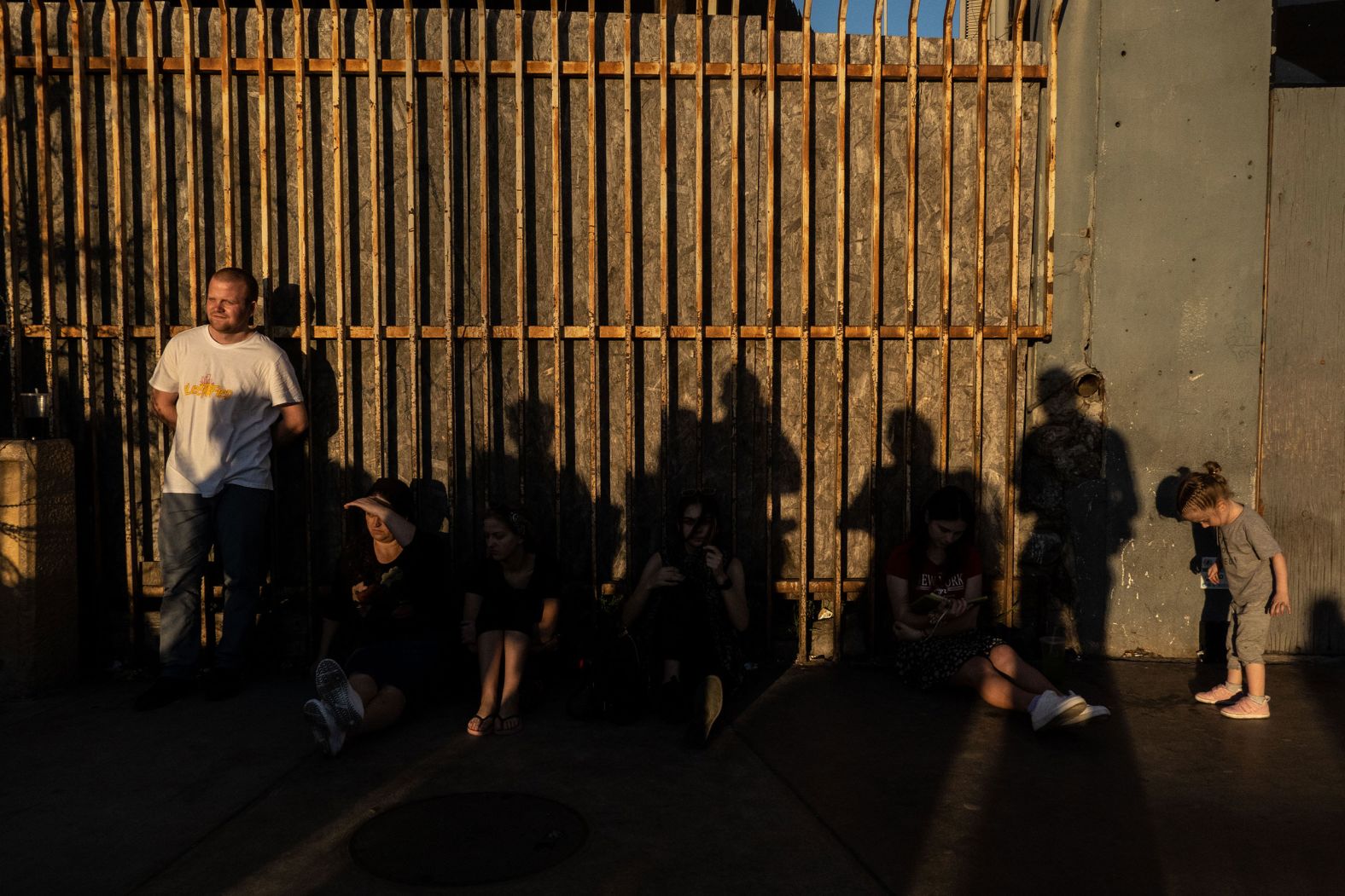 Ukrainians wait to cross the San Ysidro Port of Entry bridge in Tijuana on March 23. Ukrainians hoping to seek refuge in the United States have been coming to Tijuana for months, according to the city's head of migrant affairs. And the number increased after Russia's invasion of Ukraine.