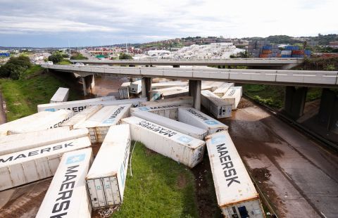 Shipping containers are washed away in Durban on April 12.