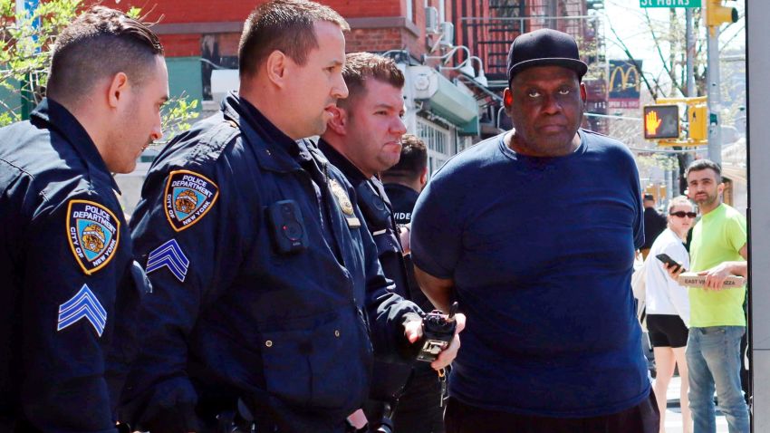 New York City Police Department officers arrest subway shooting suspect Frank R. James, 62, in the East Village section, of New York, Wednesday, April 13, 2022. The man accused of shooting multiple people on a Brooklyn subway train was arrested Wednesday and charged with a federal terrorism offense after a daylong manhunt and a tipster's call brought police to him on a Manhattan street. (AP Photo/Meredith Goldberg)