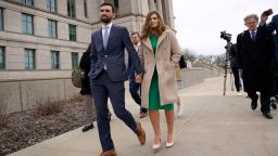 Iowa Senate hopeful Abby Finkenauer leaves the state Supreme Court building in Des Moines with her husband, Daniel Wasta, on April 13, 2022.