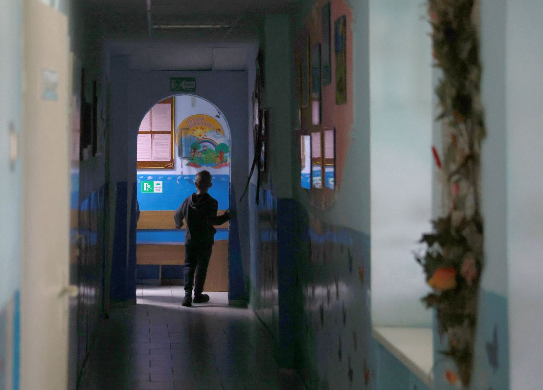A child walks down a hallway in an orphanage in Lviv, Ukraine, that houses 40 children ages 3 to 18. Lviv has served as a stopover and shelter for Ukrainians fleeing the Russian invasion, either to the safety of nearby countries or the relative security of western Ukraine.