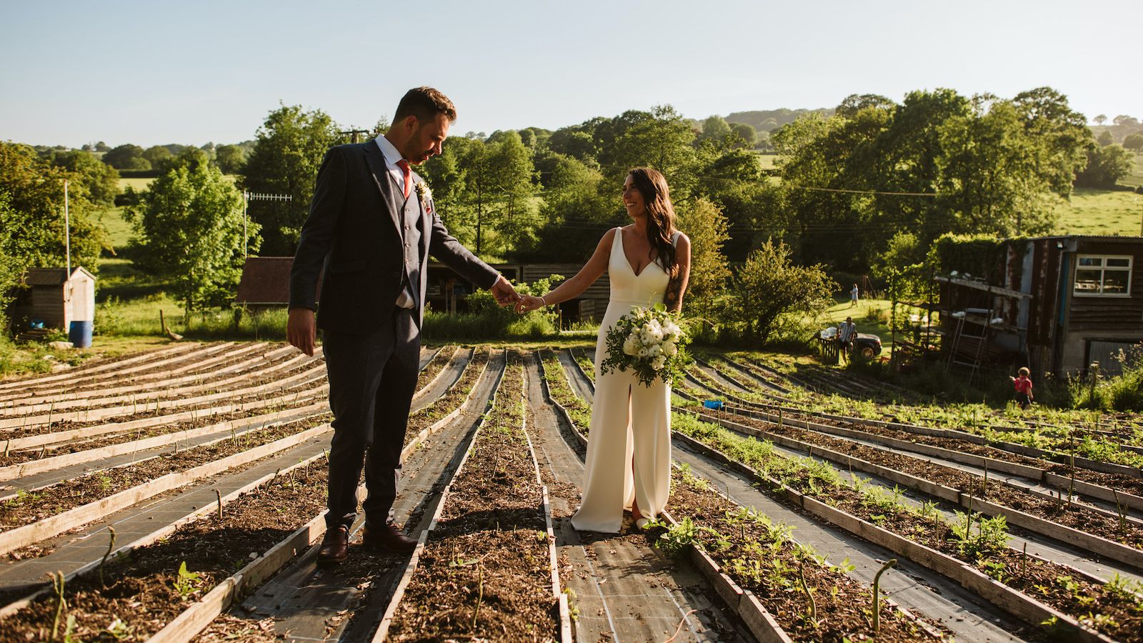 <strong>Two weddings: </strong>The couple, seen here in Gostling's asparagus field, hosted a small outdoor ceremony for 12 people and then a larger celebration in September 2021. Richard has since picked up right where she left off. So far this year, she has hosted two Girls that Scuba trips -- the first in ??the Galapagos, followed by another in the Red Sea.